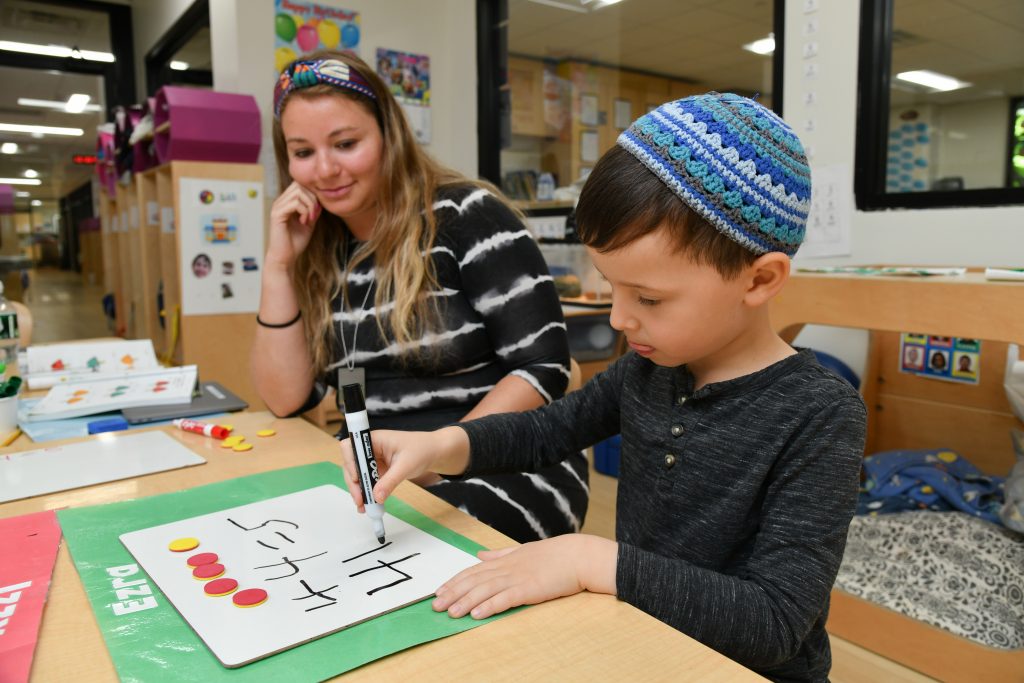 SINAI teacher and student in SAR kindergarten