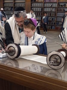 SINAI reading from the Torah at his bar mitzvah
